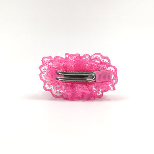 Dog accessory with pink lint detail and clip